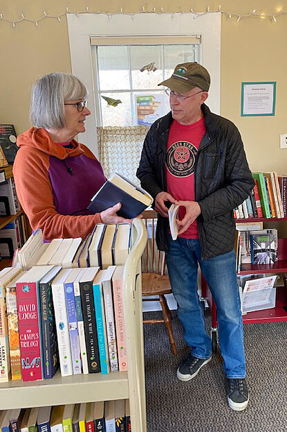 Port Townsend Library Friends President Deb Vanderbilt, left, discusses the organization of the Friends&rsquo; bookshop at the library&rsquo;s &ldquo;Pink House&rdquo; Learning Center. Leader photo by Kirk Boxleitner