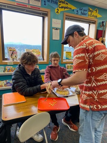 PTHS educator Reed Aubin&rsquo;s Spanish students prepare corn for making tortillas and other Latin American foods in Aubin&rsquo;s T.A.C.O. project (Teaching Academics through Culinary Opportunities), funded by a PTEF grant. Courtesy photo