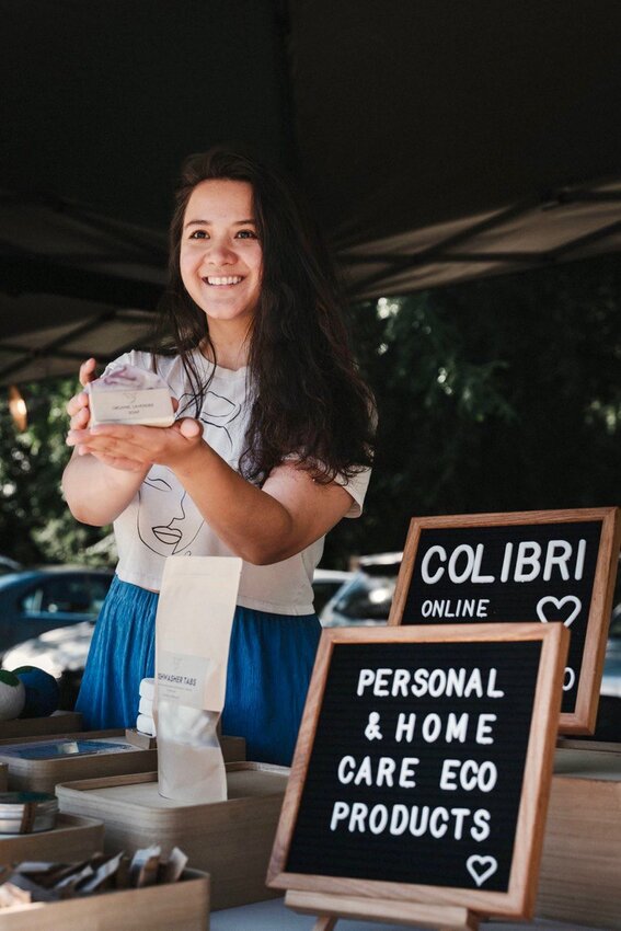 Sophia Art holds a bar of soap sold by Colibri at the Port Townsend Farmers Market. Photo courtesy of Sophia Art