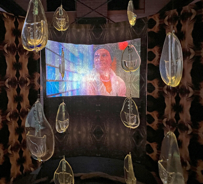 ABOVE: Viewing a constantly changing kaleidoscope of Plumb&rsquo;s images through Woelfle&rsquo;s glass droplets. RIGHT: Artist and Filmmaker Jessica Plumb.