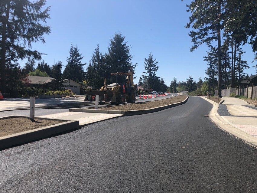 A revamped Discovery Road features fresh asphalt, a divided roadway, new sidewalk cuts and pedestrian access, and a two-lane bike path. City officials say the project is on schedule and should be finished, weather permitting, in June.