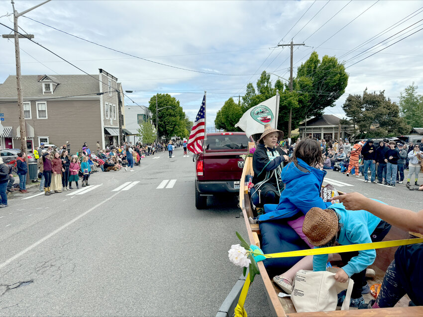 Streets of Port Townsend at the start of the parade, from the viewpoint of the Quinault canoe float.