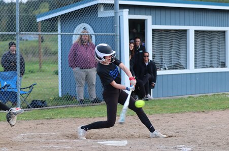 Rivals shortstop Rylee Jo Spainauer-Oas slugging at the plate.