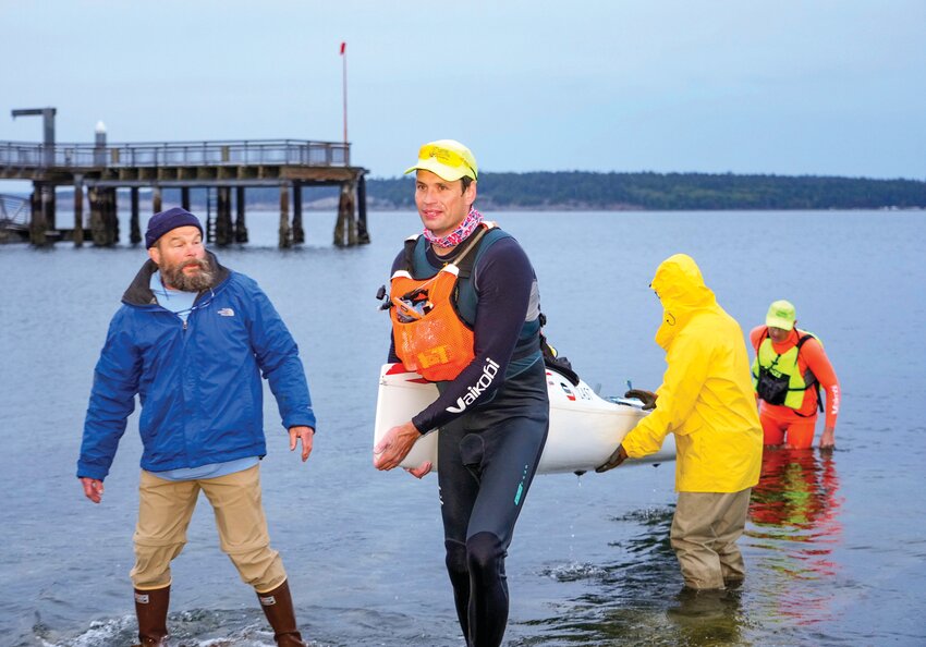 Volunteers from the Northwest Maritime Center stand ready to help the team, &ldquo;Beasts from the East,&rdquo; Egor Klevak and Ivan Medvedev, after they crossed the finish line to win the Seventy48 race from Tacoma to Port Townsend at 5:42 a.m. on Saturday, June 1. It is the second time in a row the Seattle-based team won the &ldquo;no motors, no support, no wind,&rdquo; contest. Next up is The Race to Alaska, which starts at 5 a.m. on Sunday, June 9. (See P2 brief for details.)
