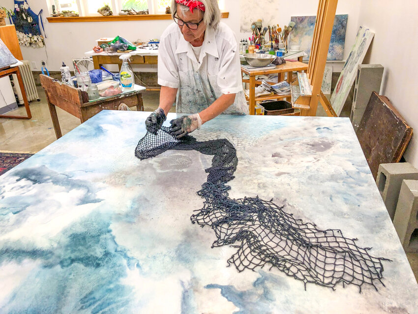 Port Townsend-based artist Shirley Scheier soaks nets with paint, and casts them over paper or canvas surfaces, to create her abstract images.