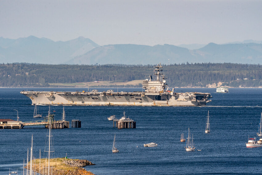 USS Ronald Reagan (CVN-76) enters Port Townsend Bay early Thursday morning, July 18. The nuclear-powered aircraft carrier later moored at Naval Magazine Indian Island. After being homeported in Japan for the past nine years, the carrier will undergo maintenance and renovations at Naval Shipyard Bremerton.