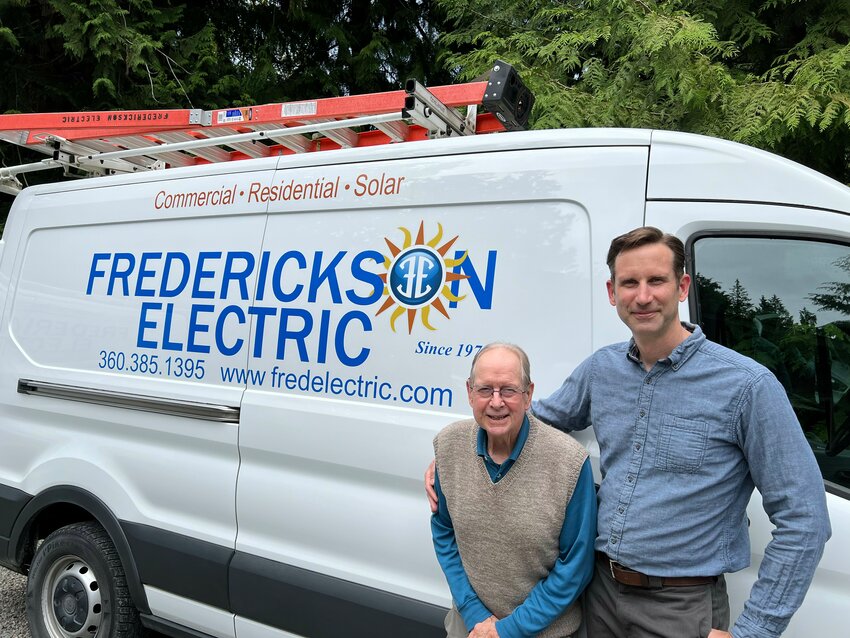 Hans Frederickson stands with his father, Erik, who opened the doors of Frederickson Electric in 1974.