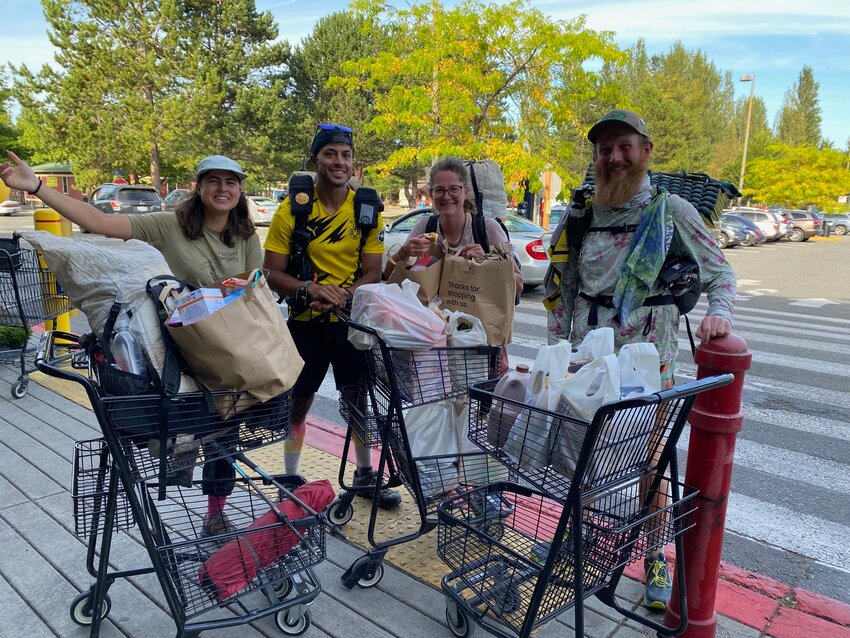 This group of worldly hikers was at Safeway in Port Townsend on Tuesday, Sept. 3, to pick up supplies before getting back on the Pacific Trail the next day. The group, which was down to the last 20% of the trip, preferred to use a mix of real and trail names. From left to right, Delia “Scratchy,” Elliot “Beats” Pacheco, Timon, and Ben “Mash.” Scratchy and Timon had come from “the middle” of Switzerland, Mash from Bedford near London, and Pacheco from New Jersey. The groceries cost more than $500, which didn’t include groceries belonging to a fifth friend, still inside paying.