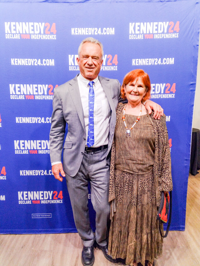 Sol Riou stands next to then-presidential candidate Robert F. Kennedy Jr., who has since endorsed Donald J. Trump.