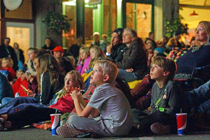 Children and adults alike enjoy a free film screening on Taylor Street during a past Port Townsend Film Festival.