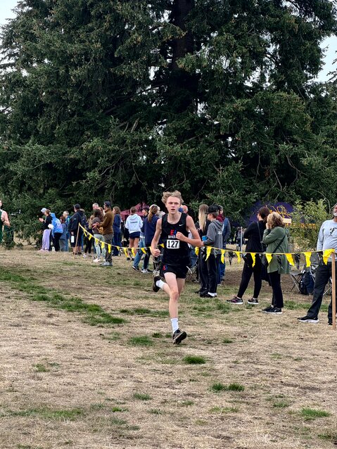 Nathan Ericson (# 127) sprints for the finish in the junior varsity boys race during the home meet at Camas Prairie Park. Photos courtesy of Susan Albee