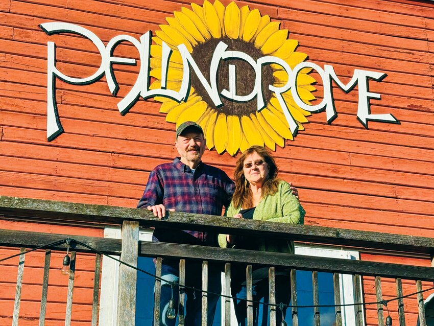 Jim, left, and Trudy Davis pose for a photo on the deck at the Palindrome.