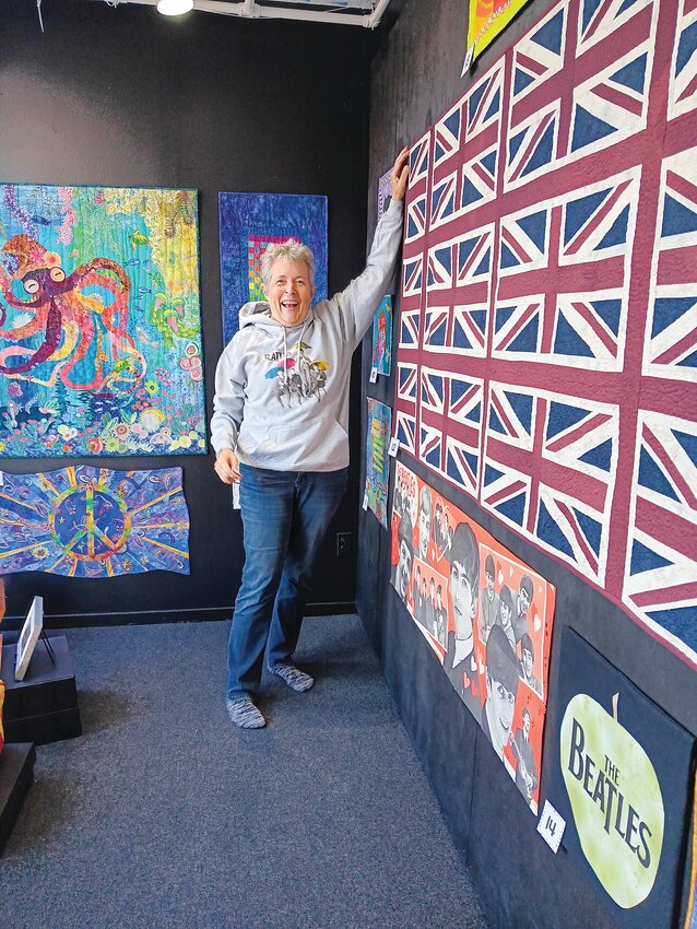 Port Angeles textile artist Merrie Jo Schroeder has been the curator for the &ldquo;Beatlemania&rdquo; walk-by exhibit at 675 Tyler St. in Port Townsend, whose display of Beatles memorabilia alongside Beatles-themed art quilts and textile pieces continues through November.