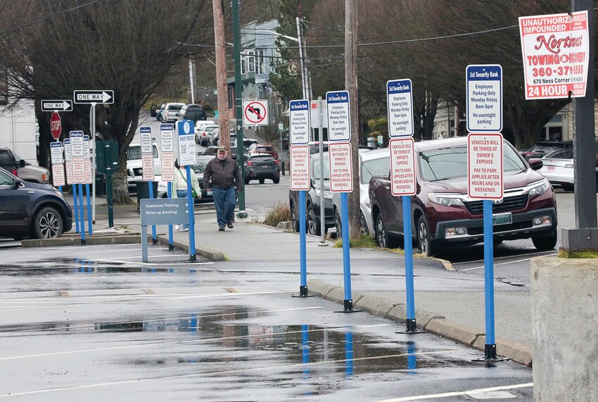 First Security Bank&rsquo;s parking lot, at the corner of Adams and Washington, allows public parking on nights and weekends using a QR code to pay. City officials have suggested using similar signage and technology for paid parking on downtown streets.