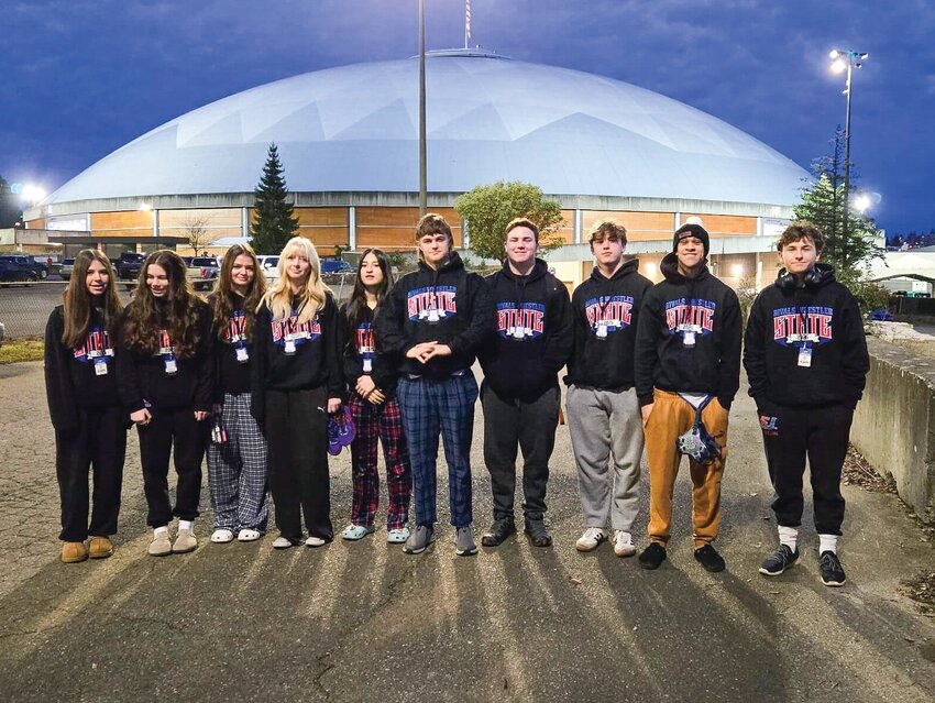 East Jefferson wrestlers on the morning of Feb. 21, just before weighing in for competition, at the 2025 Mat Classic state championships at the Tacoma Dome.