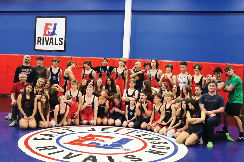 36 Middle School Wrestlers and seven coaches share a fun moment during a team photo shoot during the 3rd week of practice on the day that all wrestlers donned singlets for the first time this season.