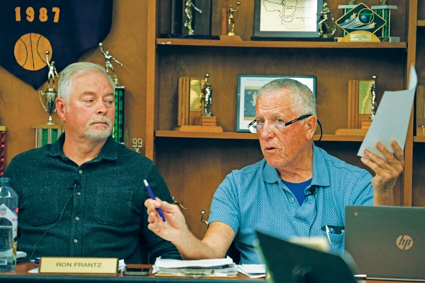 Quilcene school board member Ron Frantz listens as fellow board member Jim Hodgson speaks during the Sept. 18, 2024, meeting.