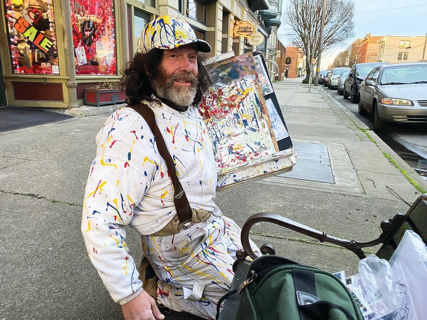 Painter Marty David poses for a photo along Water Street in downtown Port Townsend.