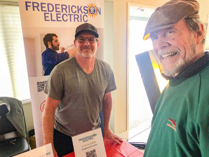 Pat Cooper consulting with Frank Trafton of Frederickson Electric about his potential emergency power needs.