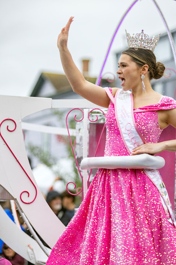 Chimachum High School senior Taylor Frank waved to crowds during the Rhododendron Festival&rsquo;s Grand Parade on Saturday, May 17, as the 2025 queen atop the Rhody Fest float.