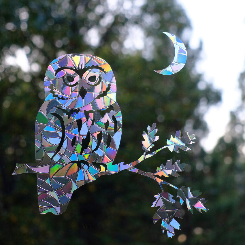 Window-collision treatments, such as Window Gems&rsquo; prismatic decals, are lifesavers for birds.