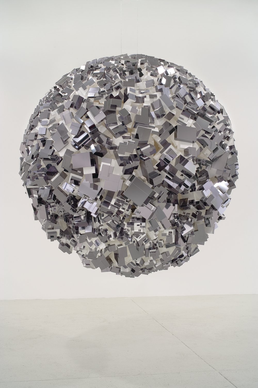 Artist John Powers constructed “Empire,” at top, with polystyrene and aluminum in 2008.