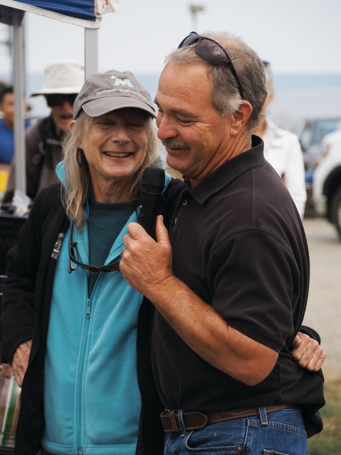 Commissioners Carol Hasse and Pete Hanke share a moment during the groundbreaking ceremony recalling their long and stories ties to Point Hudson.