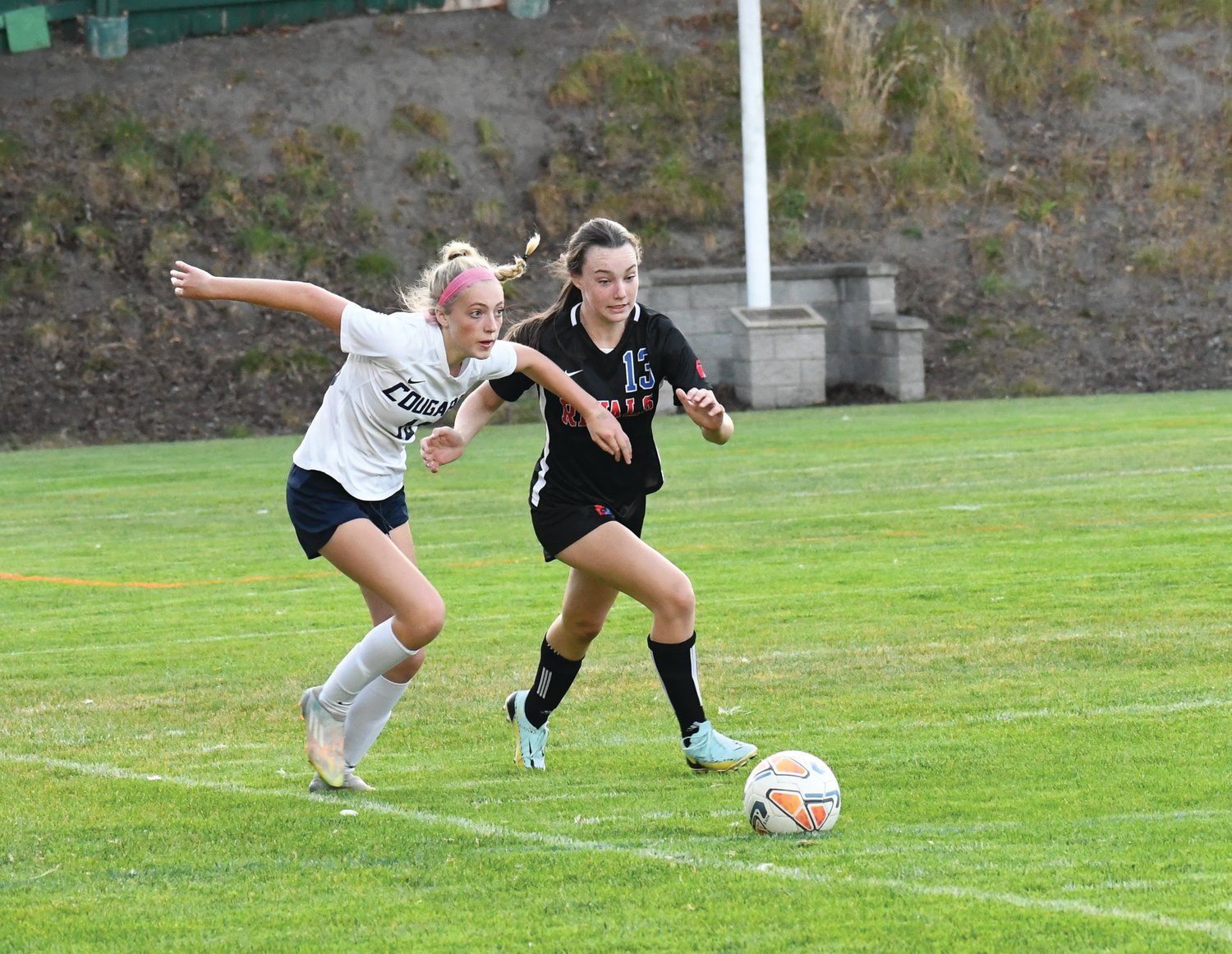 EJ defender Kay Botkin regains possession of the ball on the sideline.