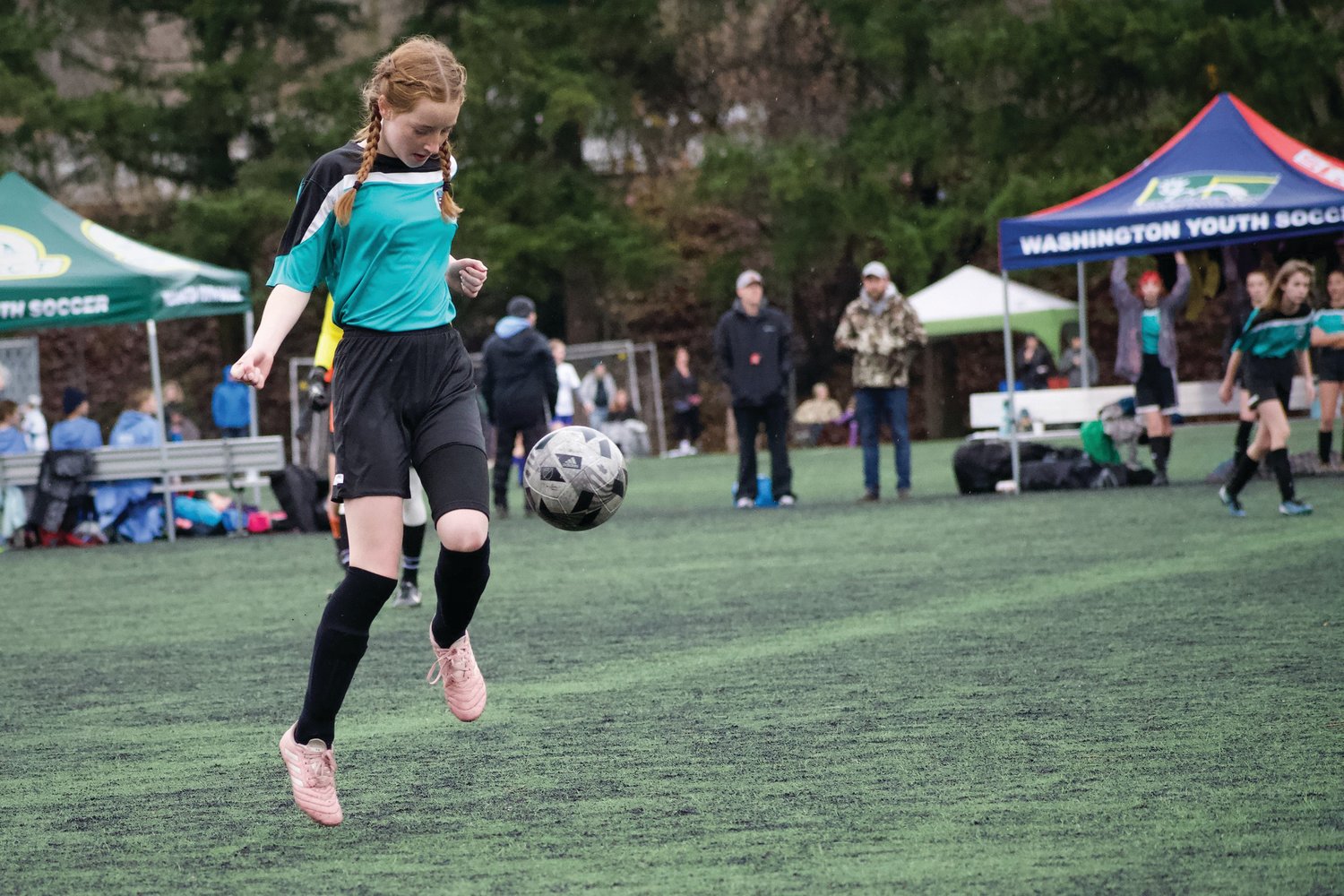 Fern French of the U-14 Bobcats juggles the ball in the air during a soccer matchup. Jim Emory photo