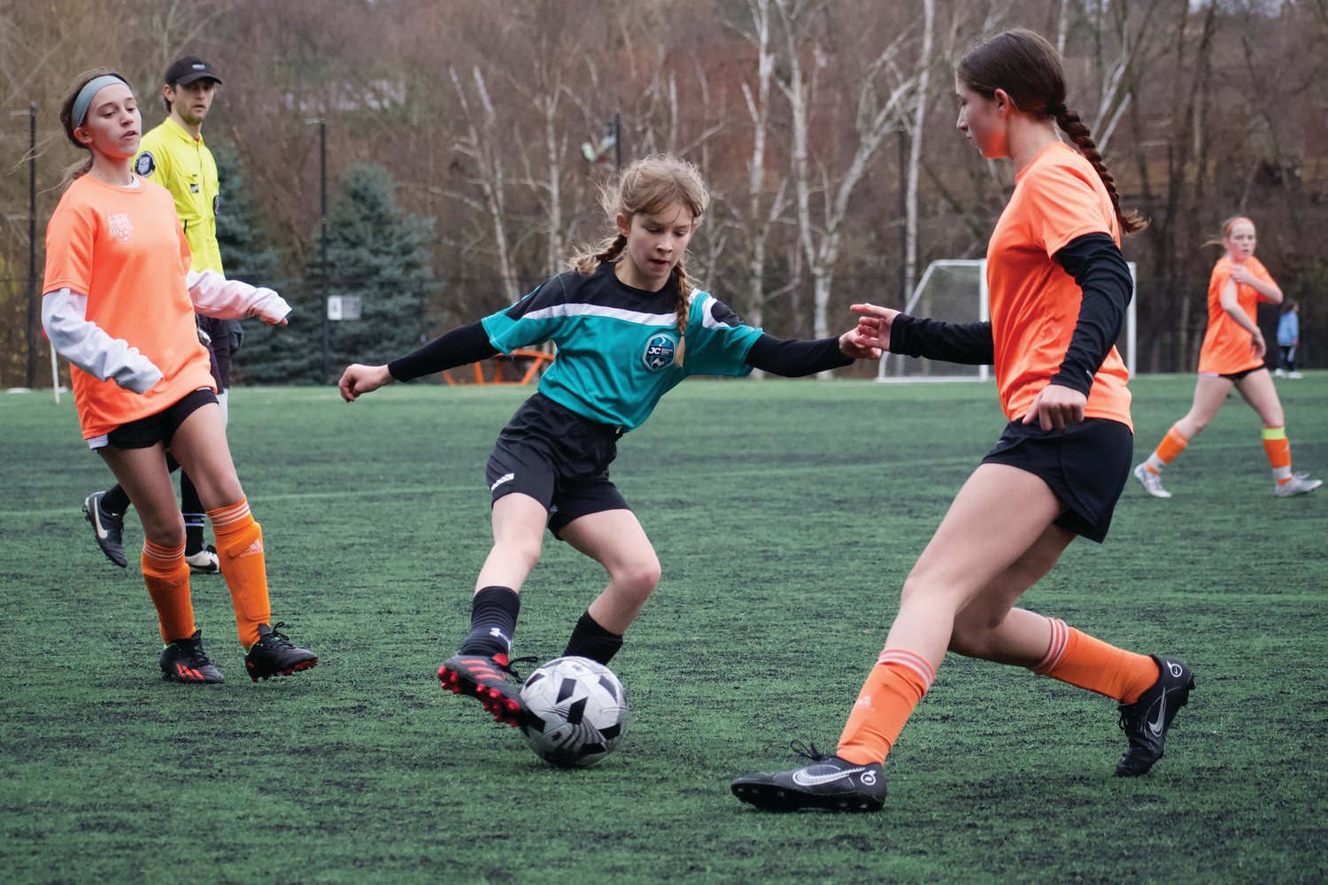 Molly Brown of the U-14 Bobcats cuts inside to dribble forward for a scoring chance. Jim Emory photo