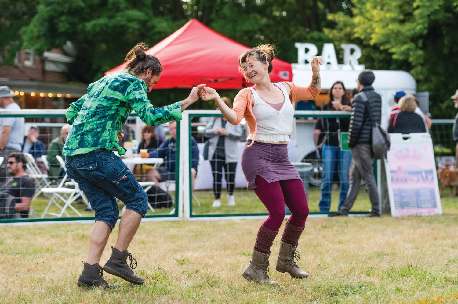 Wren LaFeet and Sarah Peller dancing at the Field Day event last July at Fort Worden.