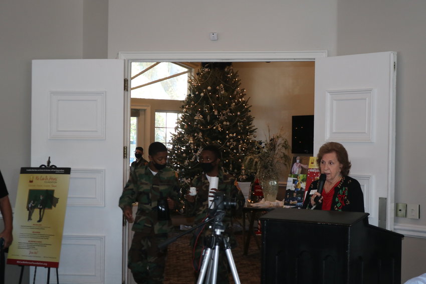 We Can Be Heroes Foundation President Beth Hughes addresses those attending the Pearl Harbor Day Breakfast.