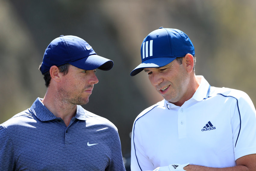 PONTE VEDRA BEACH, FLORIDA - MARCH 11: Rory McIlroy of Northern Ireland talks to Sergio Garcia of Spain during the first round of THE PLAYERS Championship on THE PLAYERS Stadium Course at TPC Sawgrass on March 11, 2021 in Ponte Vedra Beach, Florida. (Photo by Sam Greenwood/Getty Images)