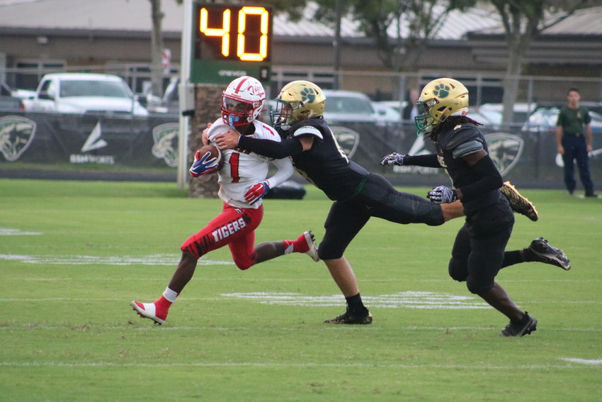 Nease linebacker Joe Miracle chases down a Jackson ball carrier.