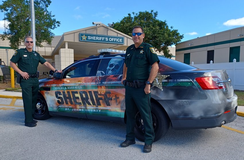 Speeders beware! If you see this St. Johns County Sheriff&rsquo;s Office patrol car in your rearview mirror, you might want to slow down. The Halloween-themed vehicle, specially wrapped for the holiday by #201WRAP, has been out generating excitement for Sheriff Hardwick&rsquo;s Haunted Jail. Pictured with the car is Deputy John Van Wagner, left, and Capt. Bobby Dean.