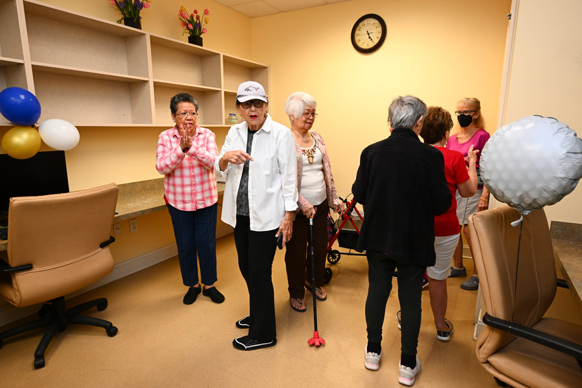 Visitors to THE PLAYERS Championship Community Senior Center examine the new computer lab donated by THE PLAYERS Championship.