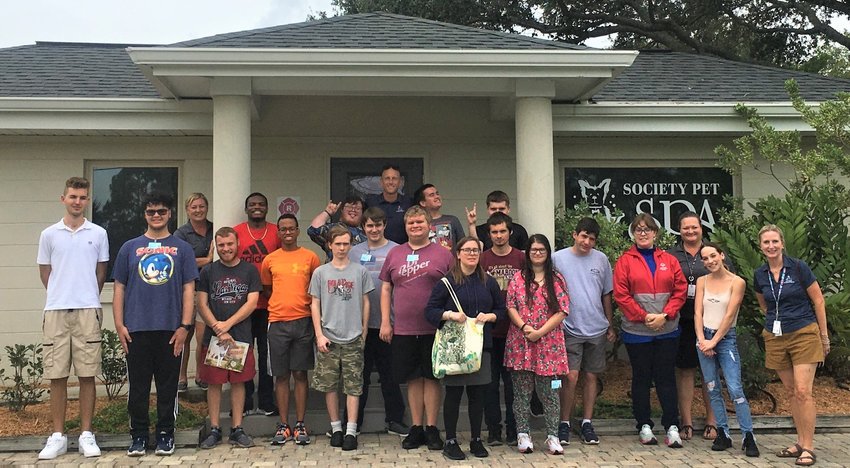 Pictured from left are, front row: Faith Northrup and Taylor Brooks; second row, Noah Brzinski, Hector Diaz-Cabrera, Ethan Johnson, Kai Duren, Sam Morrison, Cyris Matern, Matthew Sponagle, Patrick Timoney, Zach Conway, Krisina Hess, job coach Tracy Munoz, Humane Society volunteer Vanessa Hofer and job coach Ami Brennan; third row, teacher Tracy Holland, Marion Boyd, Kevin Harrison, Parker Andersen and Aiden Chubbuck; back, teacher Adam Ringwood.