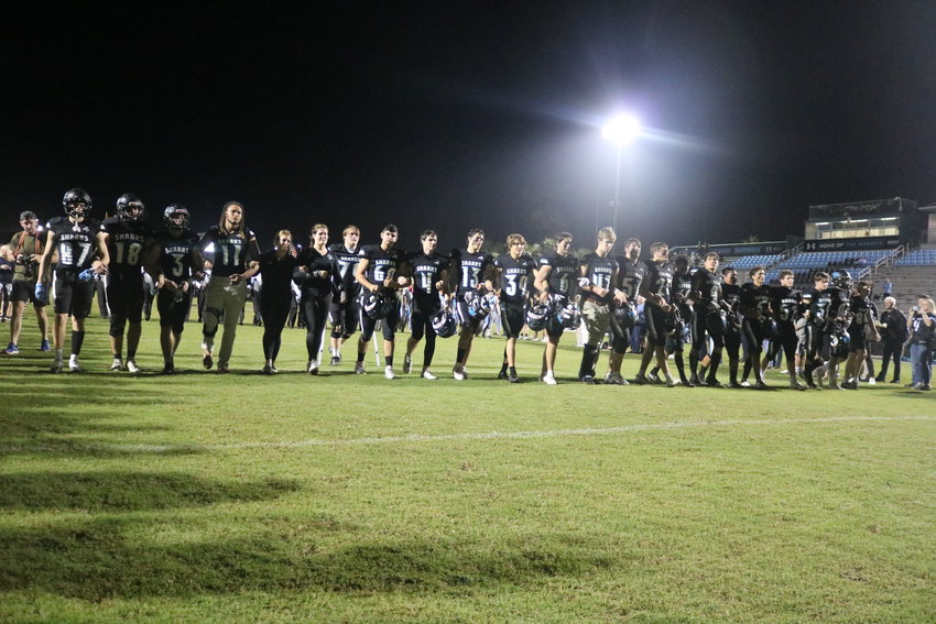 Seniors on the Ponte Vedra football team walk down the field between friends and family for the last time following the team&rsquo;s senior night contest against Creekside Nov. 4.