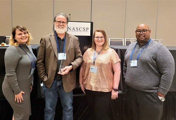 Pictured from left: Danielle McNair, interim WAP Community Program manager, Department of Economic Self-Sufficiency; Bill Lazar, executive director, St. Johns Housing Partnership; Linzi Gano, weatherization manager and LIHEAP A/C Program coordinator, Step-Up Suncoast; and Frankie Hernandez, CSBG Community Program manager, Department of Economic Self-Sufficiency