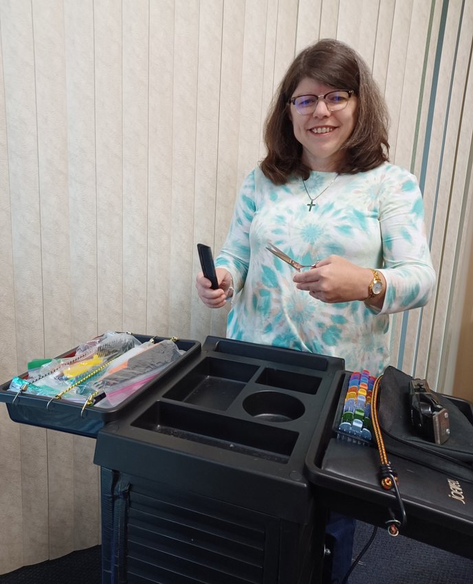 Dana L. Rector is seen with her mobile salon. After more than 30 years of hair-styling experience, she now brings her services directly to the customer.