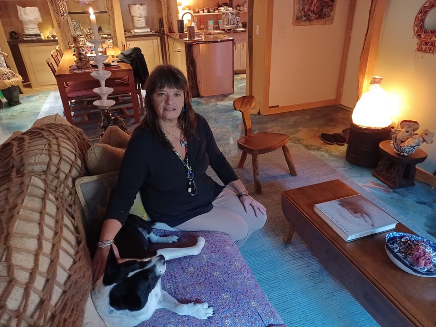 Stacy Cushman&rsquo;s entire condominium is an art gallery. Even the floor is a work of art. The lamp and candle holder are her own creations, while pieces collected from all over the world fill every available space.