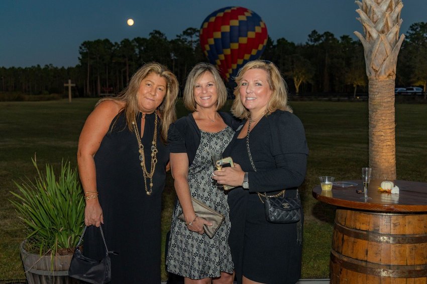 Pictured from left, Berkshire Hathaway HomeServices Florida Network Realty&rsquo;s Laura Kelly, Tracy Glochau and Amy Alloways at the Balloon Glow Gala.
