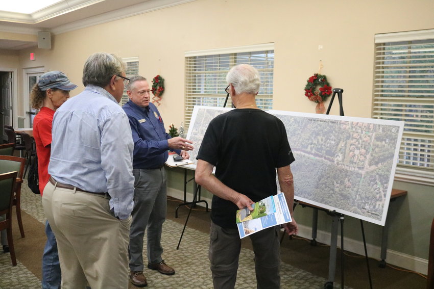 Jason Sparks with St. Johns County Public Works talks to residents during the Palm Valley sidewalk open house Dec. 8.