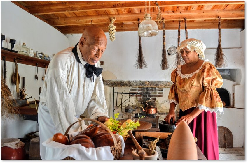 Black history tour actors are seen in the kitchen of the Ximenez-Fatio House Museum.
