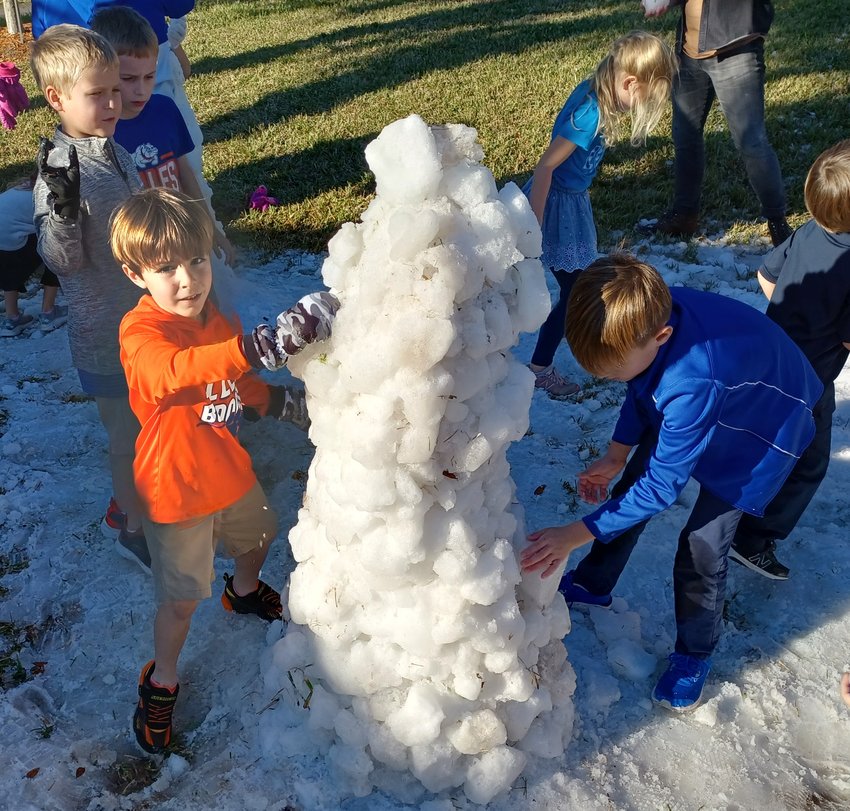 A group of boys built this snowman at the school&rsquo;s Winter Fest.