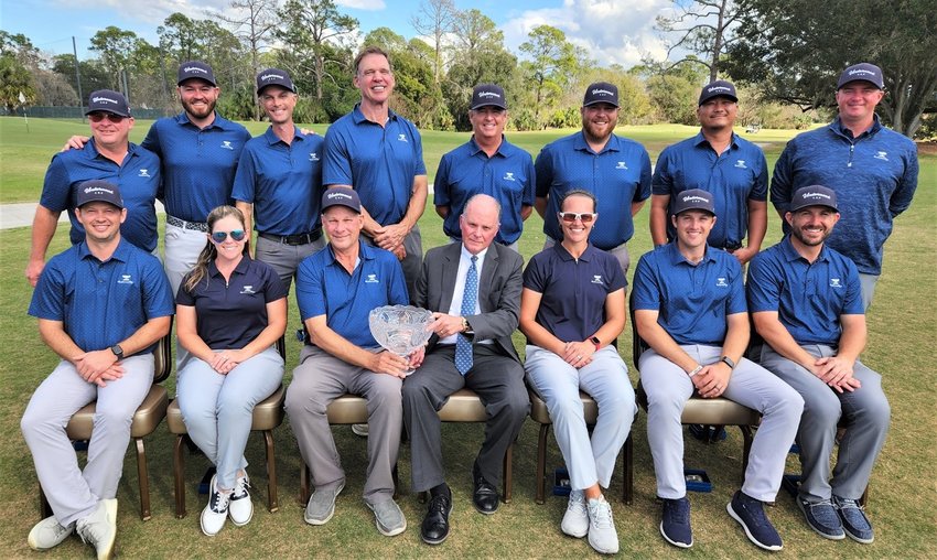 The 2023 Underwood Cup tournament sponsor Clayton Bromberg of Underwood Jewelers holds the Underwood Cup with professional team captain Tim Peterson seated to his right.
