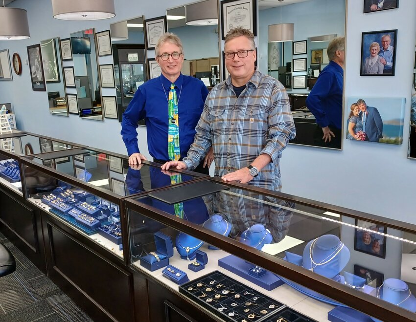 Ben, left, and Dan Espling stand behind the counter at their Jacksonville Beach store.