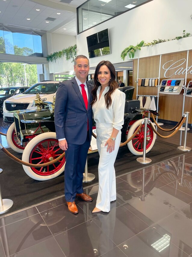 Shawn Spencer with his wife Jaime on the show room floor at the new Randy Marion Cadillac dealership in Jacksonville.