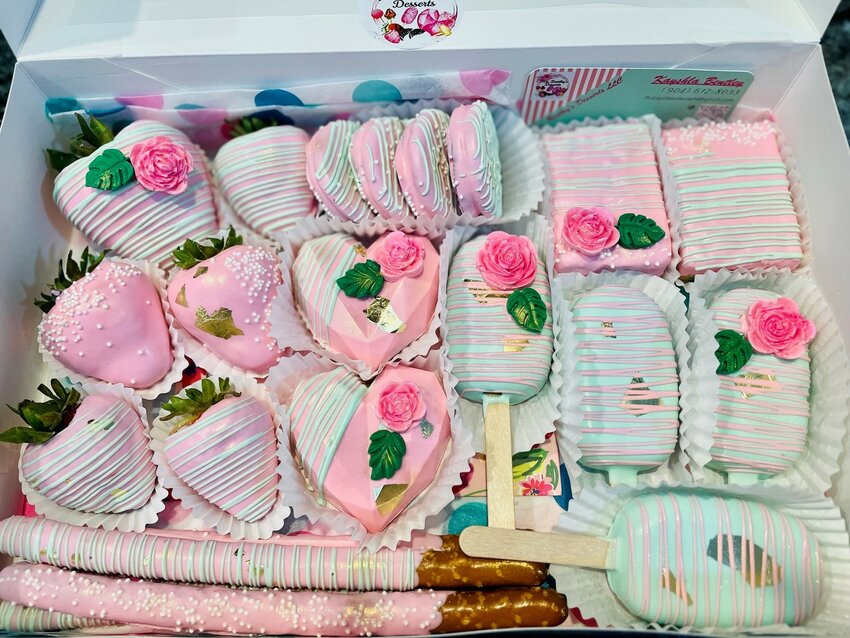 A box of assorted treats in pale pink from Mrs. Bentley&rsquo;s Desserts.