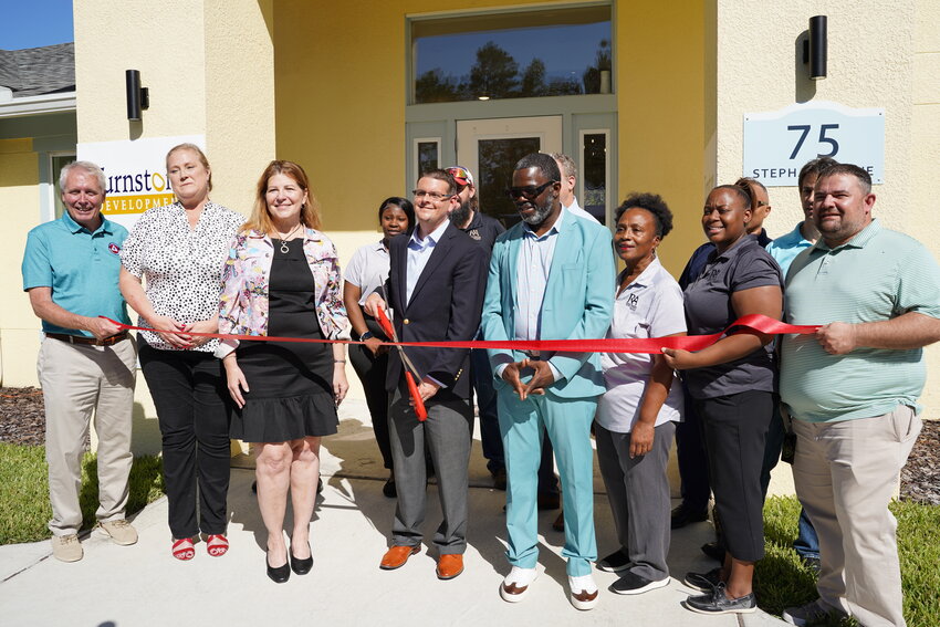 Ceremonial ribbon-cutting for Victoria Crossing featuring St. Johns County District 3 Commissioner Roy Alaimo, St. Johns County Housing and Community Development Division representatives and Turnstone Development Corp. representatives, including Maze Jackson, Sue Wiemer and Alison Culvard.
